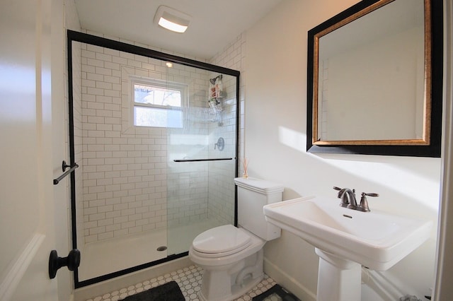 bathroom with sink, toilet, and walk in shower