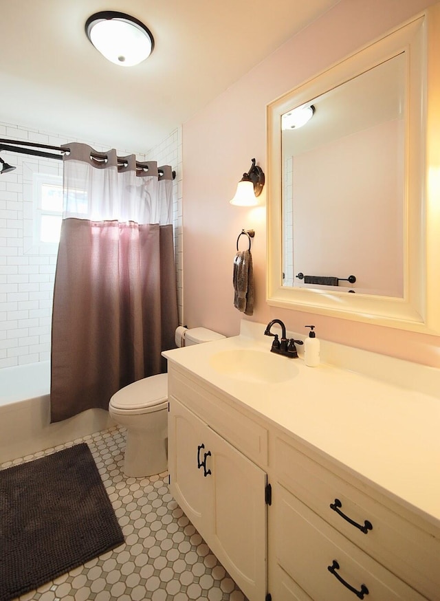 full bathroom with shower / bath combination with curtain, vanity, toilet, and tile patterned flooring