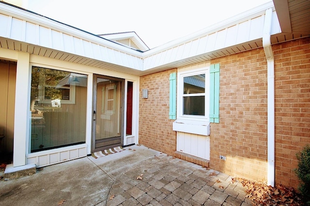 entrance to property featuring a patio area