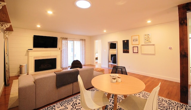 dining space with hardwood / wood-style flooring