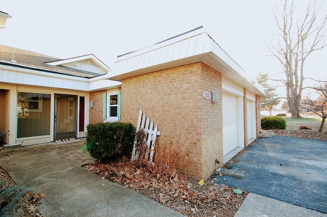 view of side of home with a garage