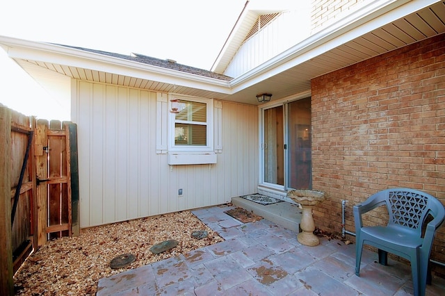 entrance to property featuring a patio