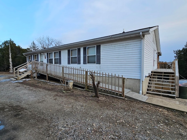 manufactured / mobile home with a wooden deck