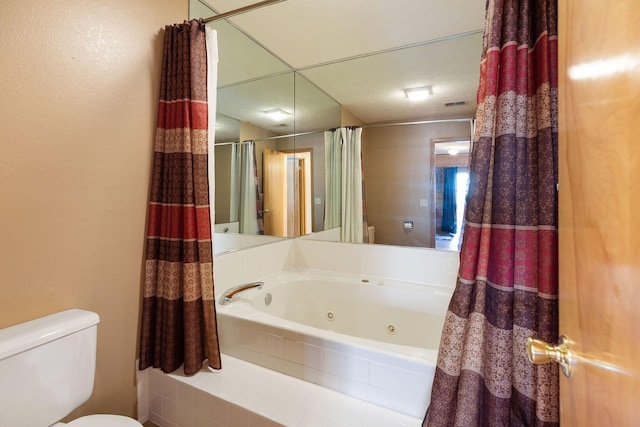 bathroom featuring shower / bath combination with curtain and toilet