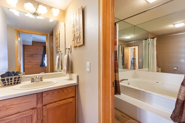 bathroom featuring vanity and shower with separate bathtub