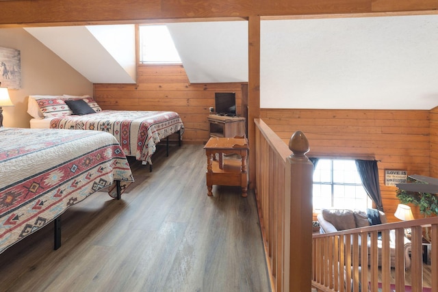 bedroom with hardwood / wood-style floors, vaulted ceiling, and wood walls