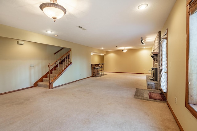 basement featuring light colored carpet and bar area