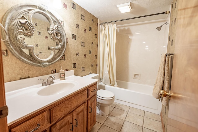 full bathroom with tile patterned floors, toilet, a textured ceiling, vanity, and shower / bath combination with curtain