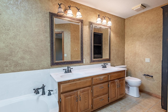 bathroom featuring vanity, toilet, tile patterned floors, and a tub to relax in