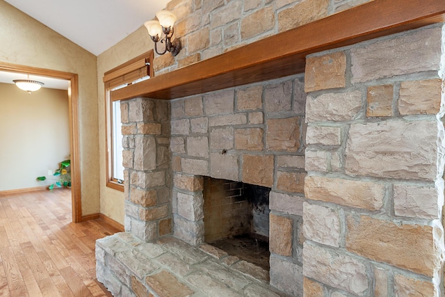 interior details with hardwood / wood-style floors and a fireplace