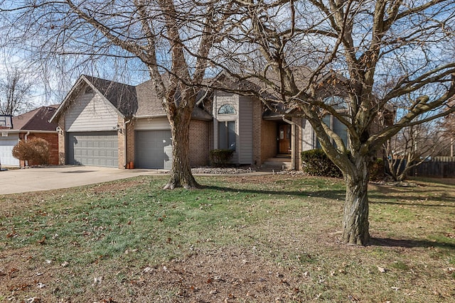 view of front of property with a garage and a front yard