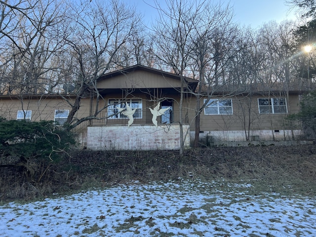 view of snow covered house