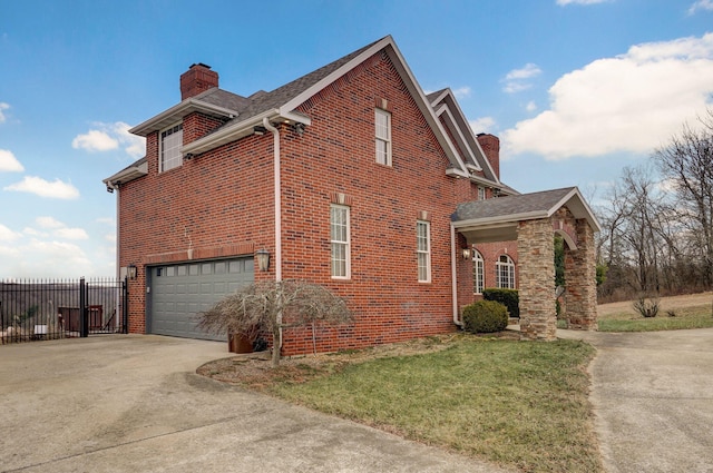 view of side of home with a garage and a lawn