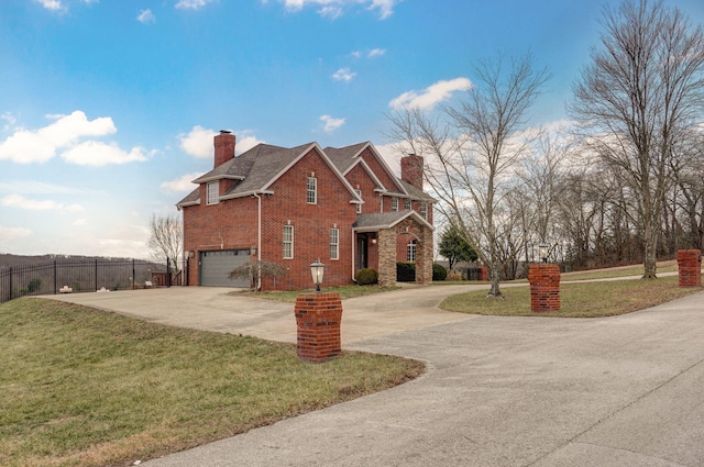 view of side of property featuring a garage and a lawn