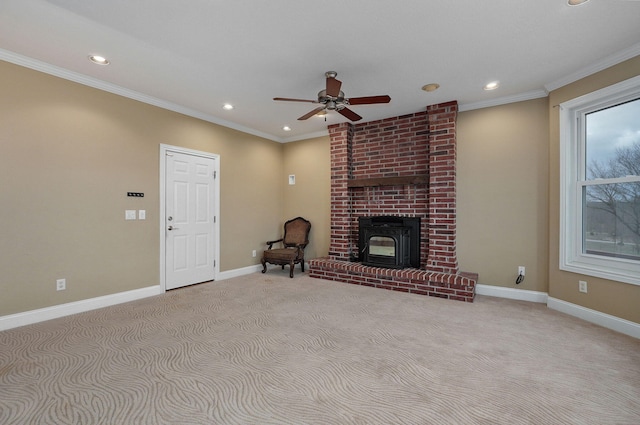 unfurnished living room featuring crown molding, light colored carpet, and ceiling fan