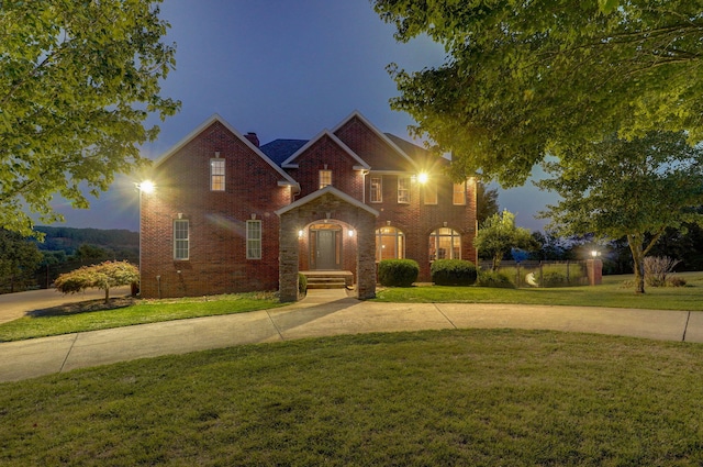 view of property featuring a yard