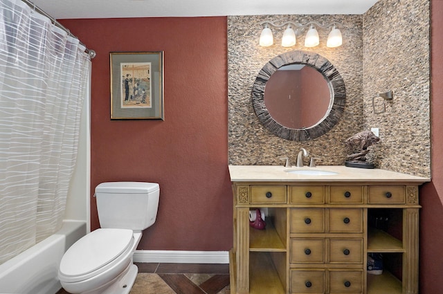 full bathroom with vanity, shower / bath combo with shower curtain, and toilet