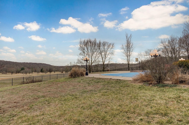 view of yard with a rural view