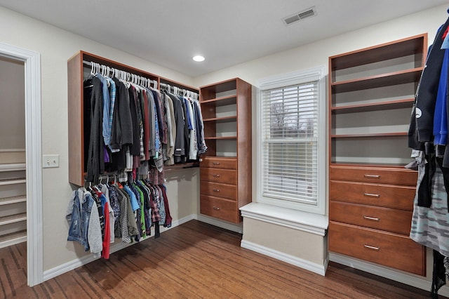 spacious closet featuring hardwood / wood-style flooring