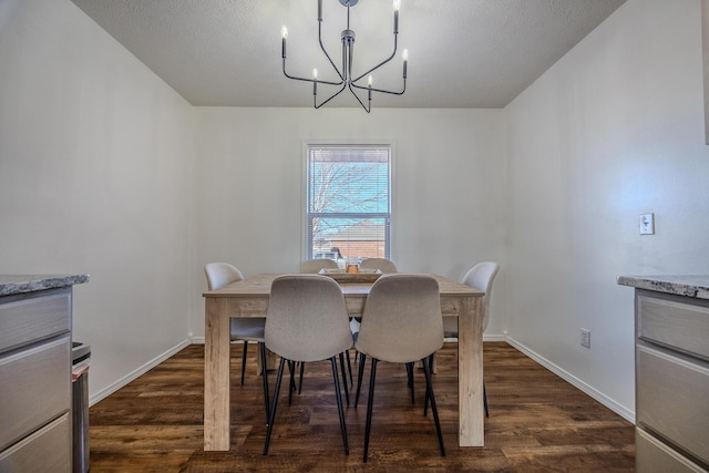 dining area with a notable chandelier and dark hardwood / wood-style floors