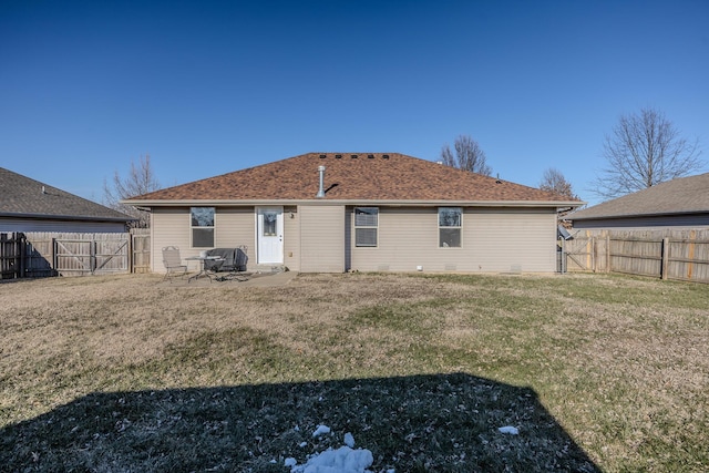 back of property featuring a lawn and a patio area