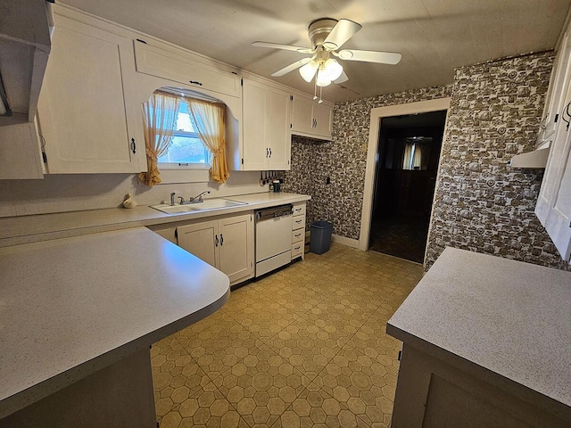 kitchen with white cabinetry, sink, ceiling fan, and white dishwasher