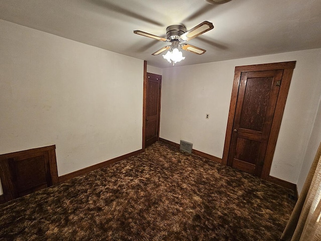 unfurnished bedroom with ceiling fan and carpet