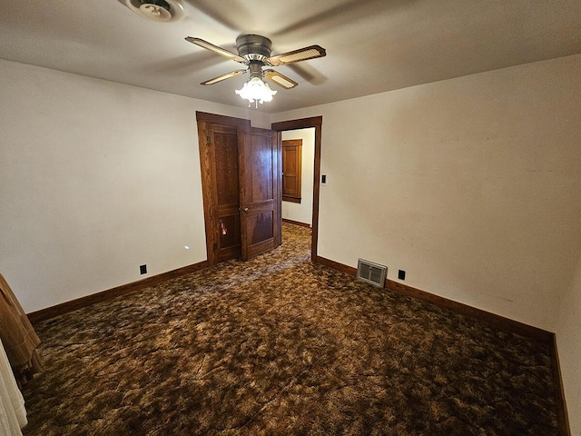 carpeted empty room with ceiling fan