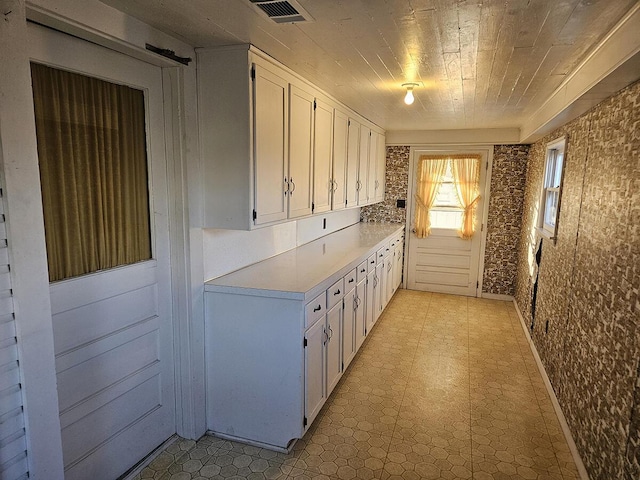 kitchen featuring white cabinets