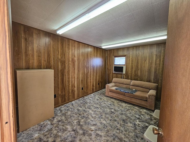 living room with wooden walls and carpet flooring