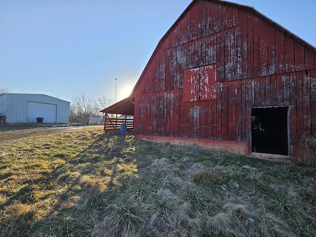 view of outbuilding featuring a lawn