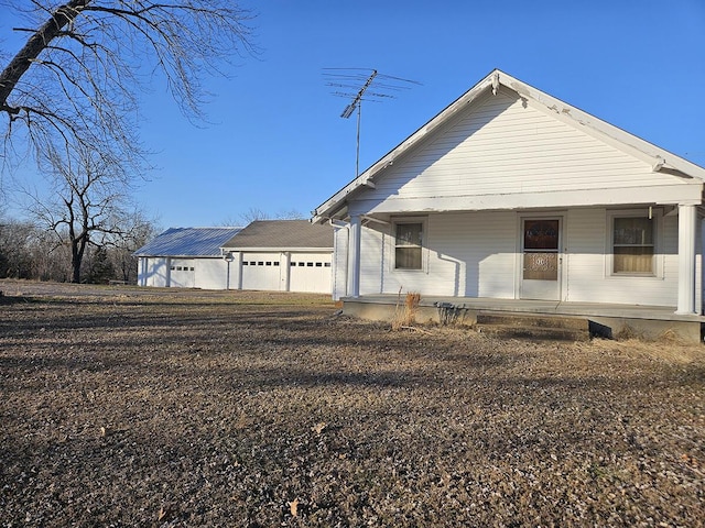 view of front of house with a garage and a porch