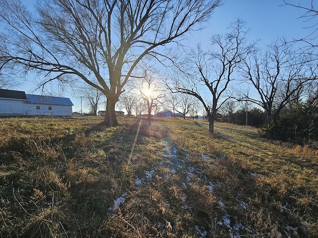 view of yard with a rural view