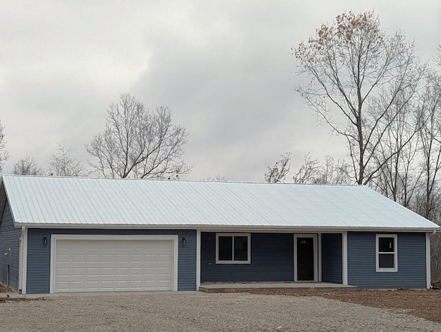 ranch-style home featuring a porch and a garage