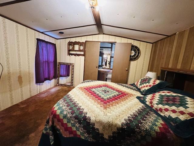 bedroom with carpet floors and lofted ceiling with beams