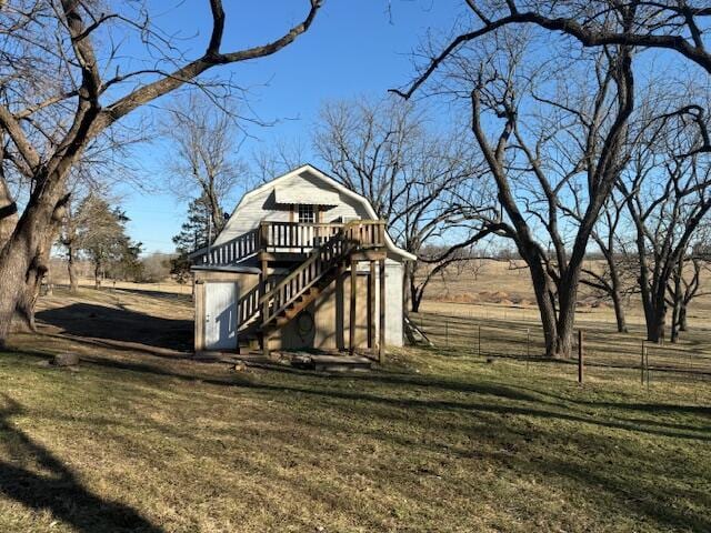 view of yard featuring a deck and a rural view