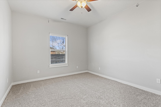 empty room with carpet and ceiling fan