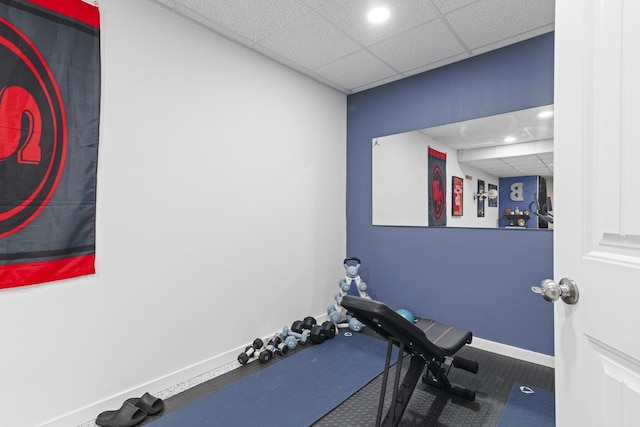 workout room featuring a drop ceiling