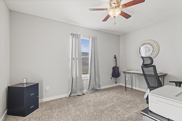 office featuring ceiling fan and light carpet