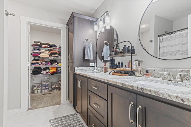 bathroom featuring vanity and a shower with shower curtain