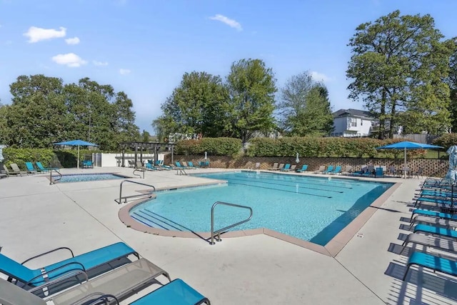 view of pool featuring a pergola and a patio area