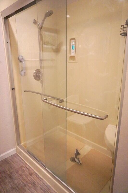 bathroom featuring an enclosed shower and hardwood / wood-style floors