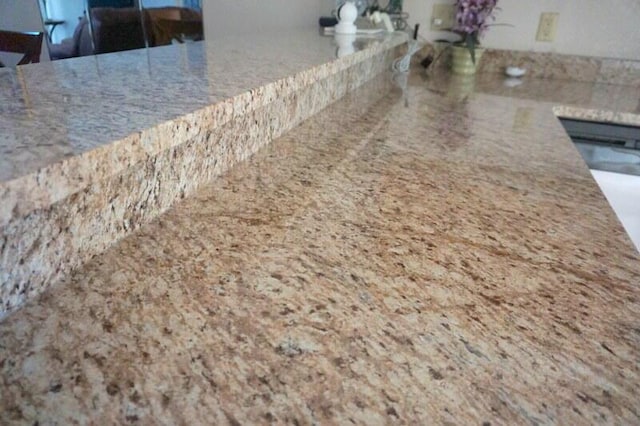 room details featuring light stone countertops