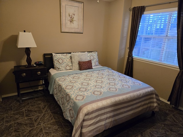 bedroom featuring multiple windows