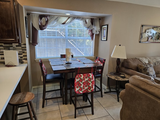 tiled dining area with a wealth of natural light