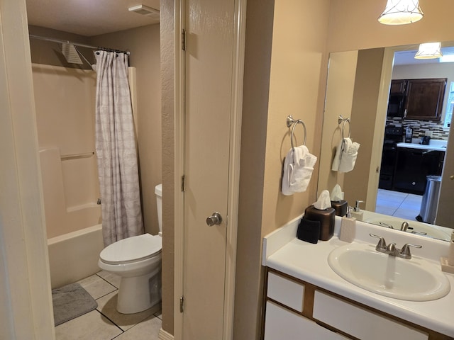 full bathroom featuring tile patterned flooring, shower / bath combo, vanity, and toilet