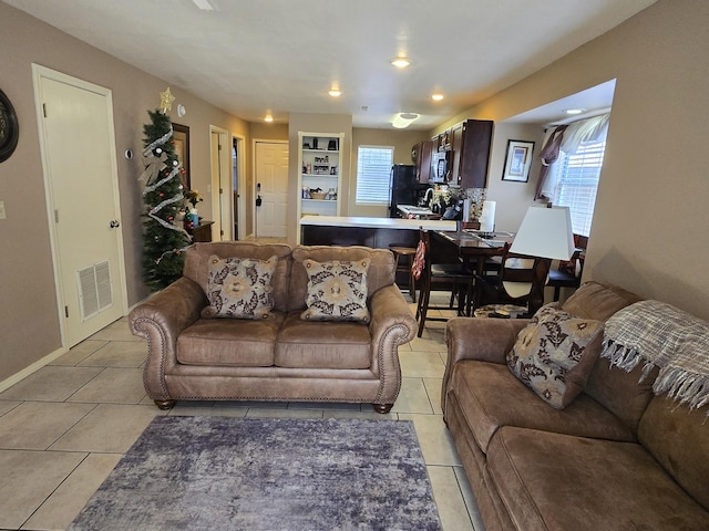 living room featuring light tile patterned floors