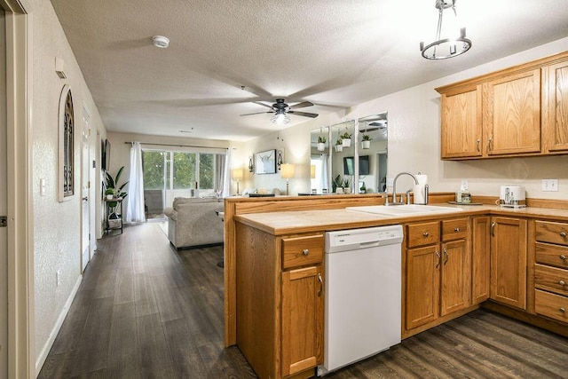 kitchen with sink, dishwasher, ceiling fan, a textured ceiling, and dark hardwood / wood-style flooring