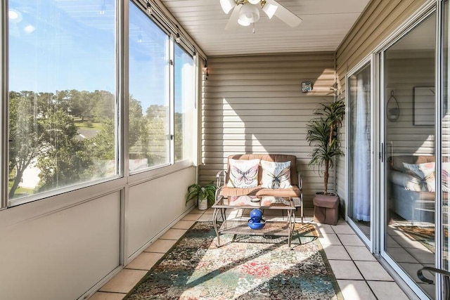 sunroom / solarium with ceiling fan and a wealth of natural light