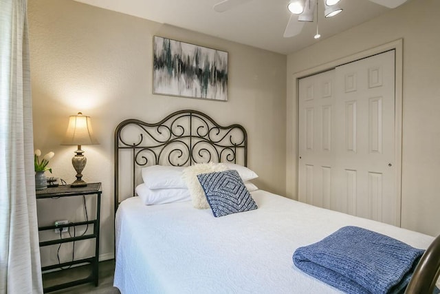 bedroom with ceiling fan and a closet